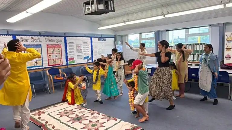Children dancing at the Sai School Hanuman Chalisa event