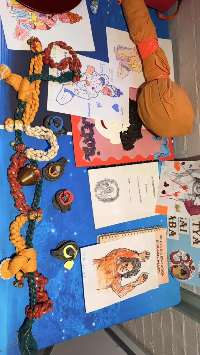 Children's artwork in the kids' zone at the Hanuman Chalisa event